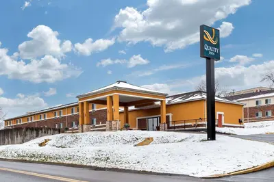 a sign in front of a building in the snow at Quality Inn Coraopolis in Coraopolis