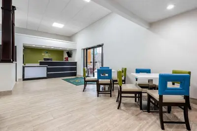 a dining room with a table and chairs at Quality Inn Coraopolis in Coraopolis