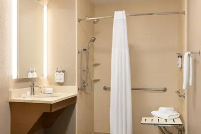 a bathroom with a sink and a shower at Staybridge Suites Fort Wayne by IHG in Fort Wayne