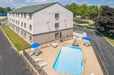 an aerial view of a building with a swimming pool at Motel 6-Milan, OH - Sandusky in Milan