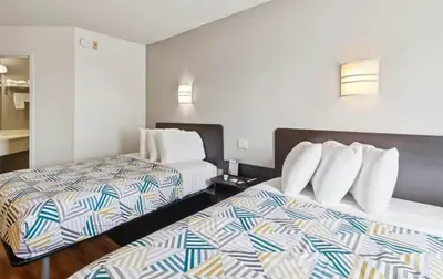a hotel room with two beds in a room at Motel 6-Milan, OH - Sandusky in Milan