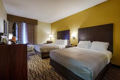 a hotel room with two beds and a large window at Quality Inn I-75 West Chester-North Cincinnati in West Chester