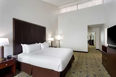 a hotel room with a large bed and a flat screen tv at DoubleTree by Hilton Washington Meadow Lands Casino Area in Washington
