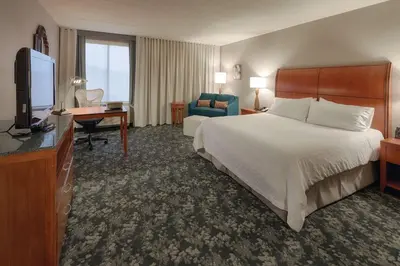 a hotel room with a bed and a television at Hilton Garden Inn Cleveland/Twinsburg in Twinsburg