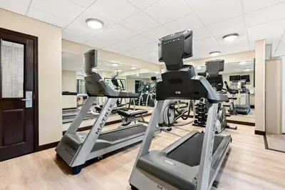 a gym with treadmills and elliptical machines at Staybridge Suites - Cincinnati North by IHG in West Chester
