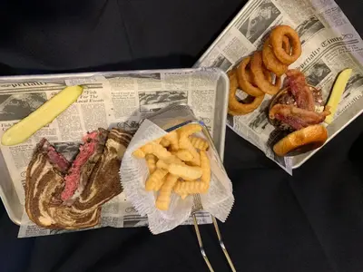 a newspaper with french fries and different types of food at Holiday Inn Cincinnati-Riverfront by IHG in Covington