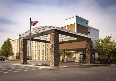 a building with an american flag in front of it at Best Western Plus Strongsville Cleveland in Strongsville