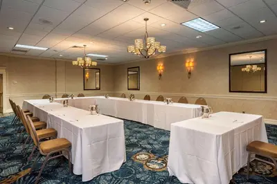 a banquet room with white tables and chairs at Best Western Plus Strongsville Cleveland in Strongsville