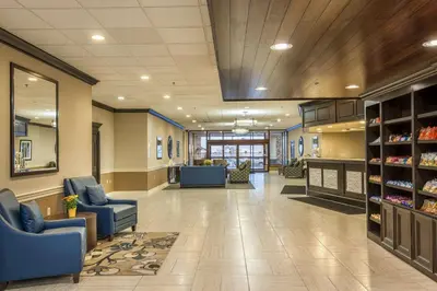 a hospital lobby with chairs and a waiting room at Best Western Plus Strongsville Cleveland in Strongsville