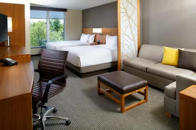 a hotel room with a bed and a couch at Hyatt Place Cleveland/Lyndhurst/Legacy Village in Lyndhurst