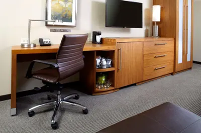 a room with a desk with a television and a chair at Hyatt Place Cleveland/Lyndhurst/Legacy Village in Lyndhurst