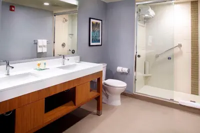 a bathroom with a sink and a toilet and a shower at Hyatt Place Cleveland/Lyndhurst/Legacy Village in Lyndhurst