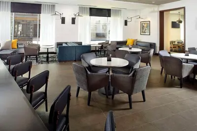 a dining room with tables and chairs and tablesktop at Hyatt Place Cleveland/Lyndhurst/Legacy Village in Lyndhurst