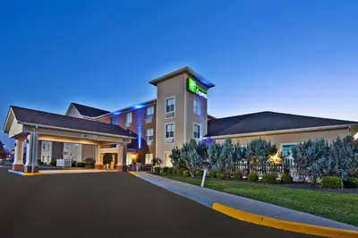 a rendering of a hotel building at night at Holiday Inn Express Hotel & Suites Columbus Southeast Groveport by IHG in Groveport