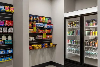 a store aisle with drinks and soda at Holiday Inn Columbus-Hilliard by IHG in New Rome