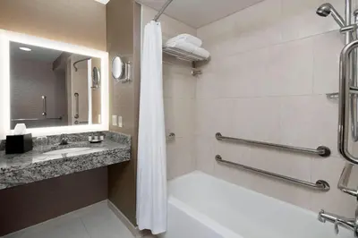 a bathroom with a shower and a sink at Sheraton Pittsburgh Airport Hotel in Coraopolis