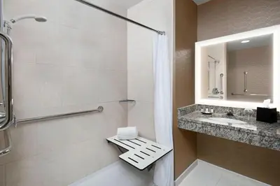 a bathroom with a shower and a sink at Sheraton Pittsburgh Airport Hotel in Coraopolis