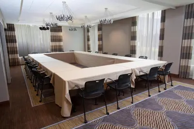 a large conference room with a large table and chairs at Sheraton Pittsburgh Airport Hotel in Coraopolis