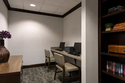 an office with a desk with two chairs and a computer at Staybridge Suites Akron-Stow-Cuyahoga Falls by IHG in Stow