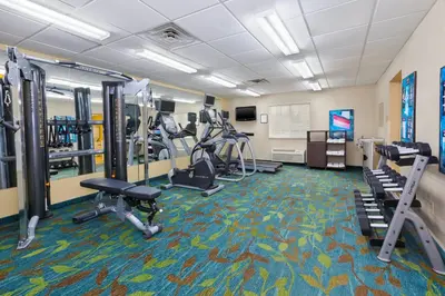 a fitness room with treadmills and tread machines at Candlewood Suites Polaris by IHG in Columbus