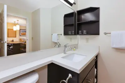 a bathroom with a sink and a mirror at Candlewood Suites Polaris by IHG in Columbus