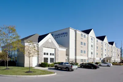 a large building with cars parked in a parking lot at Candlewood Suites Polaris by IHG in Columbus