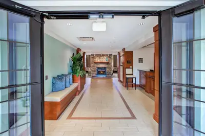 an open hallway with a living room and a fireplace at Staybridge Suites Cleveland Mayfield Heights Beachwood by IHG in Mayfield Heights
