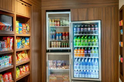 a refrigerator filled with lots of different types of drinks at Fairfield Inn & Suites by Marriott Cincinnati Uptown/University Area in Cincinnati