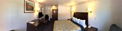 a hotel room with a bed and a television at Americas Best Value Inn of Decatur in Decatur