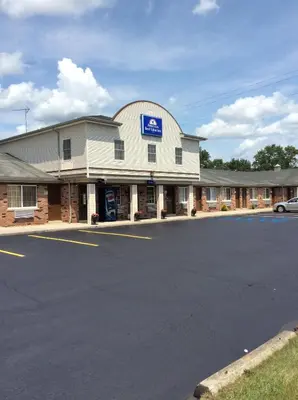 a building with a sign on the side of it at Americas Best Value Inn of Decatur in Decatur