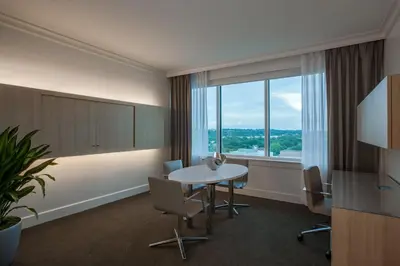 a room with a table and chairs and a large window at InterContinental Cleveland by IHG in Cleveland