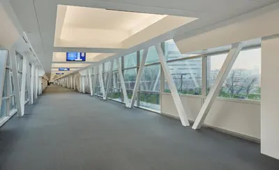 an empty hallway in a building with windows at InterContinental Cleveland by IHG in Cleveland