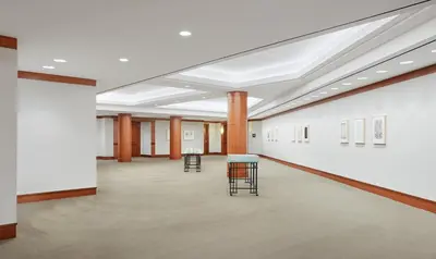 an empty room with tables and chairs in a building at InterContinental Cleveland by IHG in Cleveland