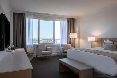 a hotel room with a bed and a large window at InterContinental Cleveland by IHG in Cleveland