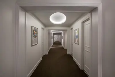 an empty hallway with a light fixture on the ceiling at InterContinental Cleveland by IHG in Cleveland