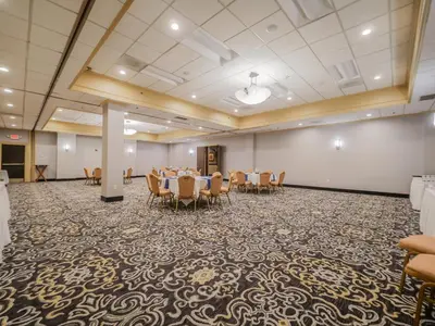 a conference room with a table and chairs in it at Crowne Plaza Cleveland Airport by IHG in Middleburg Heights