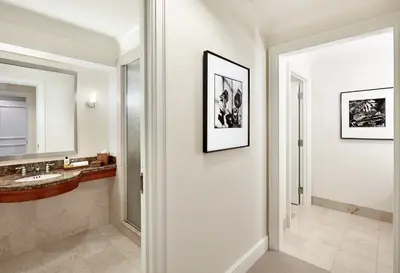 a bathroom with a sink and a mirror at InterContinental Suites Hotel Cleveland by IHG in Cleveland