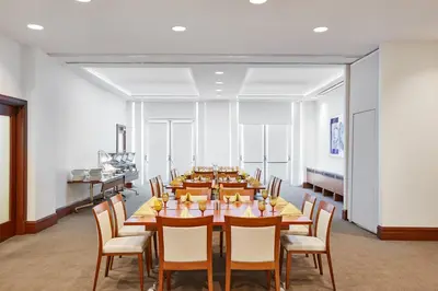 a large dining room with a long table and chairs at InterContinental Suites Hotel Cleveland by IHG in Cleveland