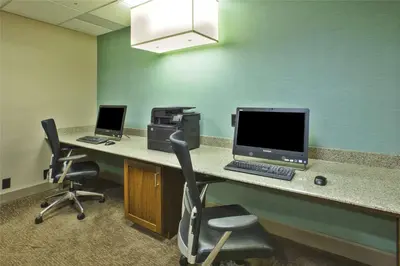 an office with two desks with a computer and a printer at Homewood Suites by Hilton Dayton South in Miamisburg
