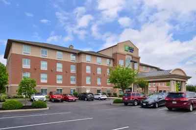 a hotel with cars parked in a parking lot at Holiday Inn Express Hotel & Suites Cincinnati - Mason by IHG in Mason