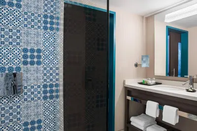 a bathroom with a shower and a sink at The Westin Cleveland Downtown in Cleveland
