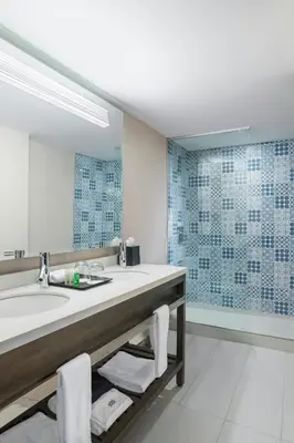 a bathroom with a sink and a mirror at The Westin Cleveland Downtown in Cleveland