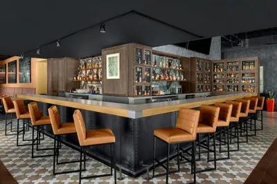 a bar in a restaurant with a bunch of chairs at The Westin Cleveland Downtown in Cleveland