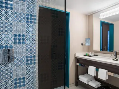 a bathroom with a shower and a sink at The Westin Cleveland Downtown in Cleveland