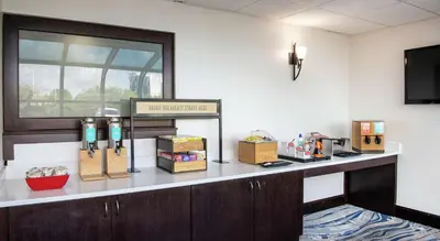 a waiting room with a counter with boxes on it at Hampton Inn Cleveland-Solon in Solon