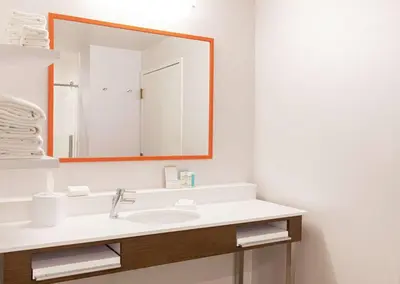 a bathroom with a sink and a mirror at Hampton Inn Cleveland-Solon in Solon