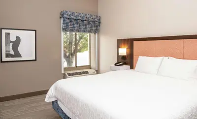 a hotel room with a large bed and a window at Hampton Inn Cleveland-Solon in Solon