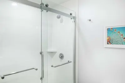 a shower in a bathroom with a glass door at Hampton Inn Cleveland-Solon in Solon