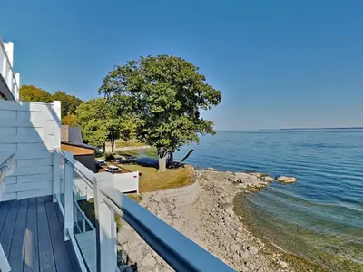 a view of the water from the balcony of a house at Put-in-Bay Waterfront Condo #211 in Put-in-Bay