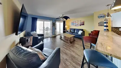 a living room with a couch and a table at Put-in-Bay Waterfront Condo #104 in Put-in-Bay